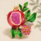 Pink Pomegranate with Flower and Leaves Brooch — styled background