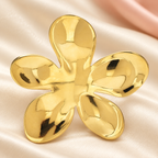 Polished Five-Petal Flower Brooch — styled background