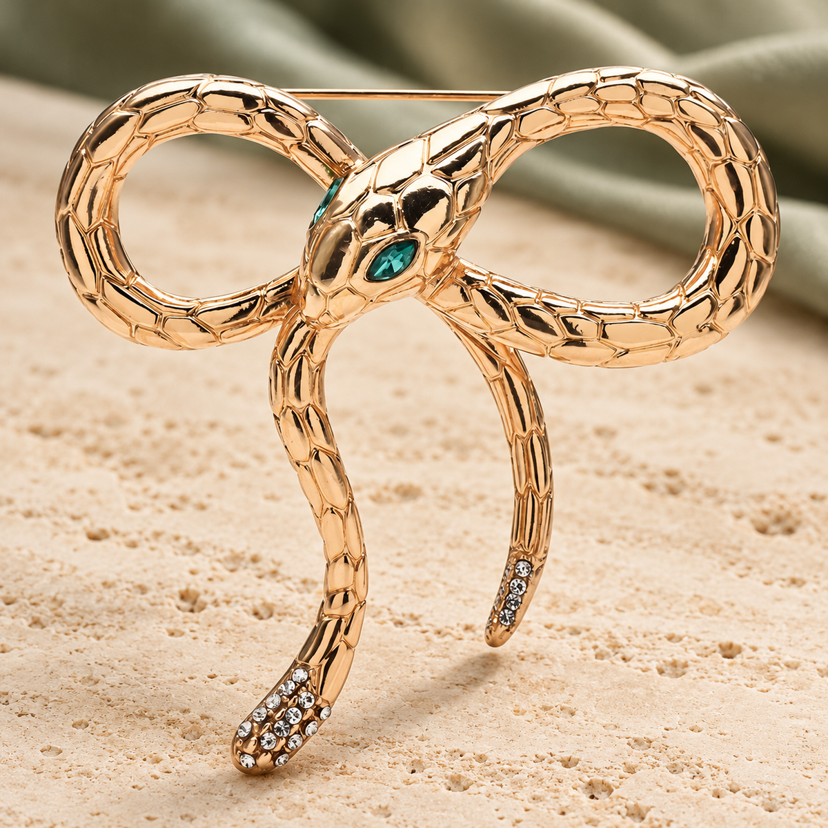 Looped Snake Bow Brooch — styled background