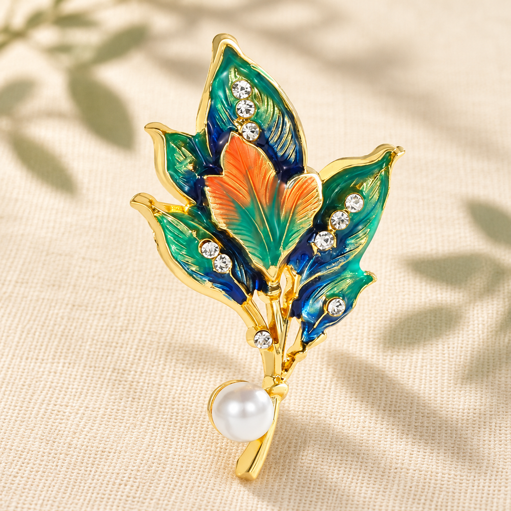 Enamel Leaf Cluster with Pearl-Look Drop Brooch — styled background