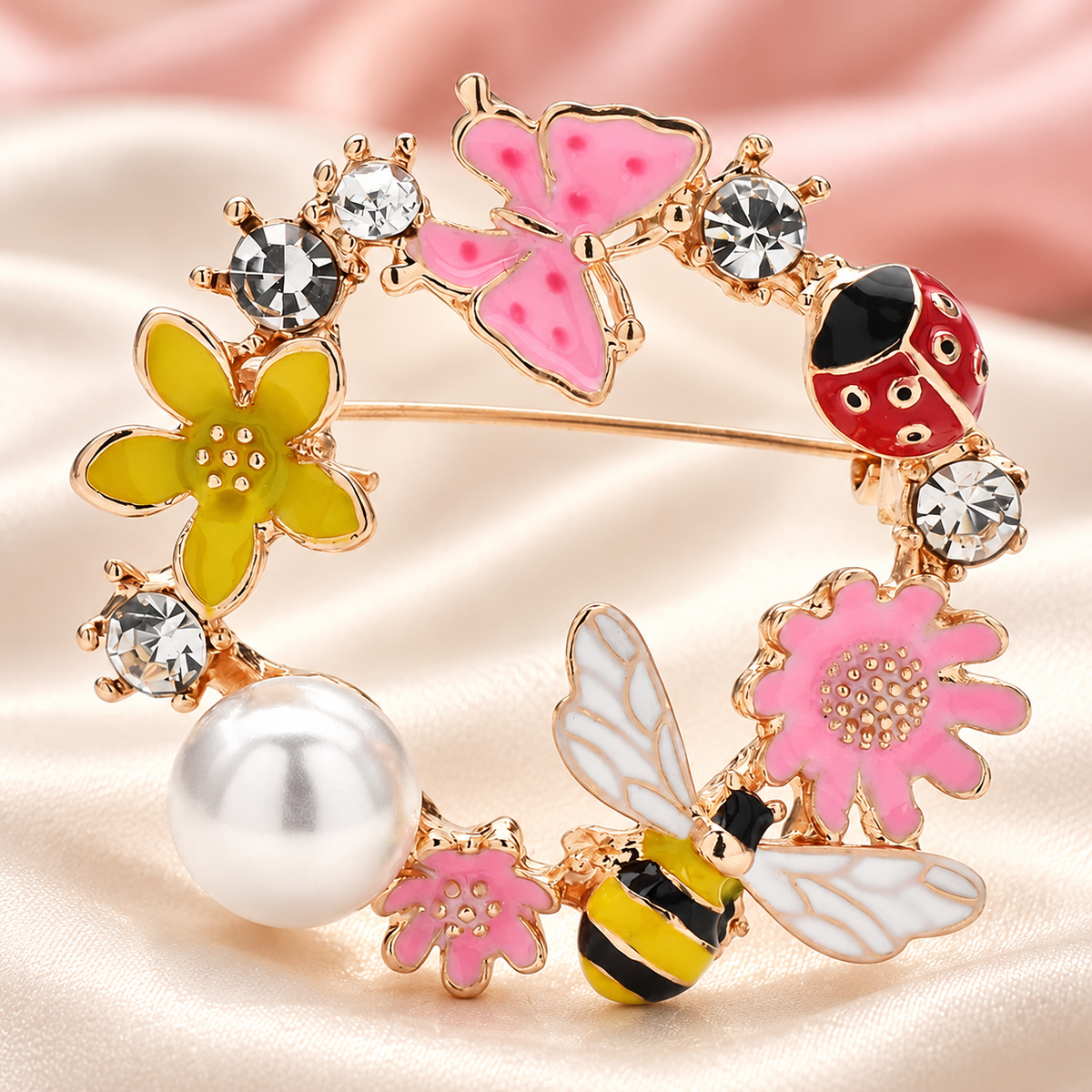 Butterfly and Bee Garden Wreath Brooch — styled background