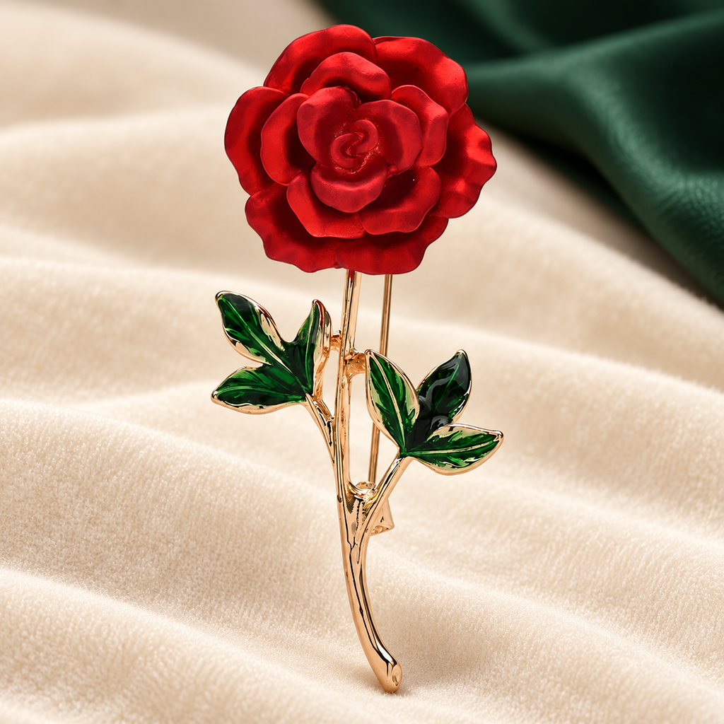 Red Enamel Rose with Green Leaves Brooch — styled background
