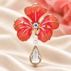 Enamel Flower with Teardrop Pendant Brooch — styled background
