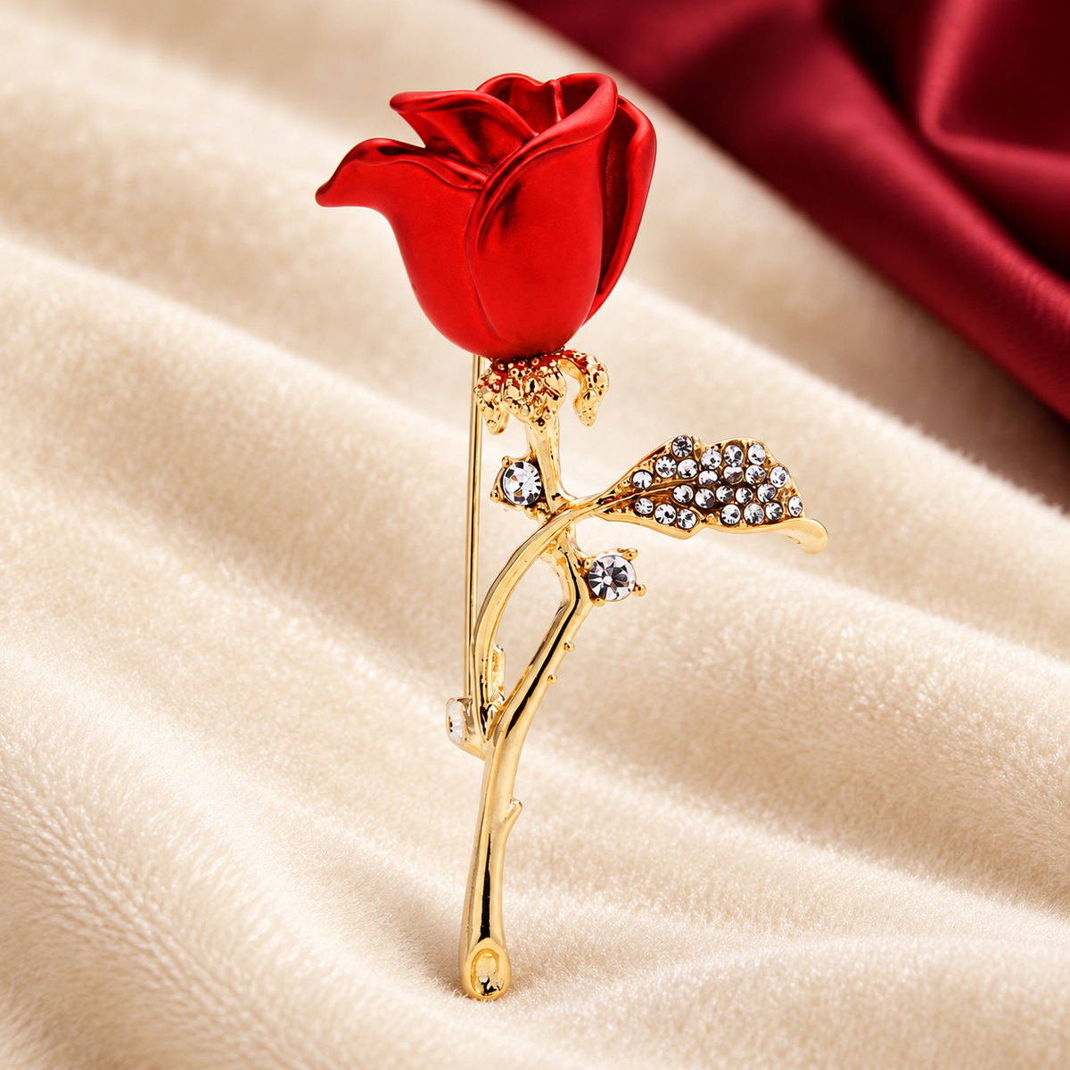 Enamel Rosebud on Jeweled Stem Brooch — styled background