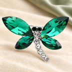 Faceted Wing Dragonfly Brooch — styled background