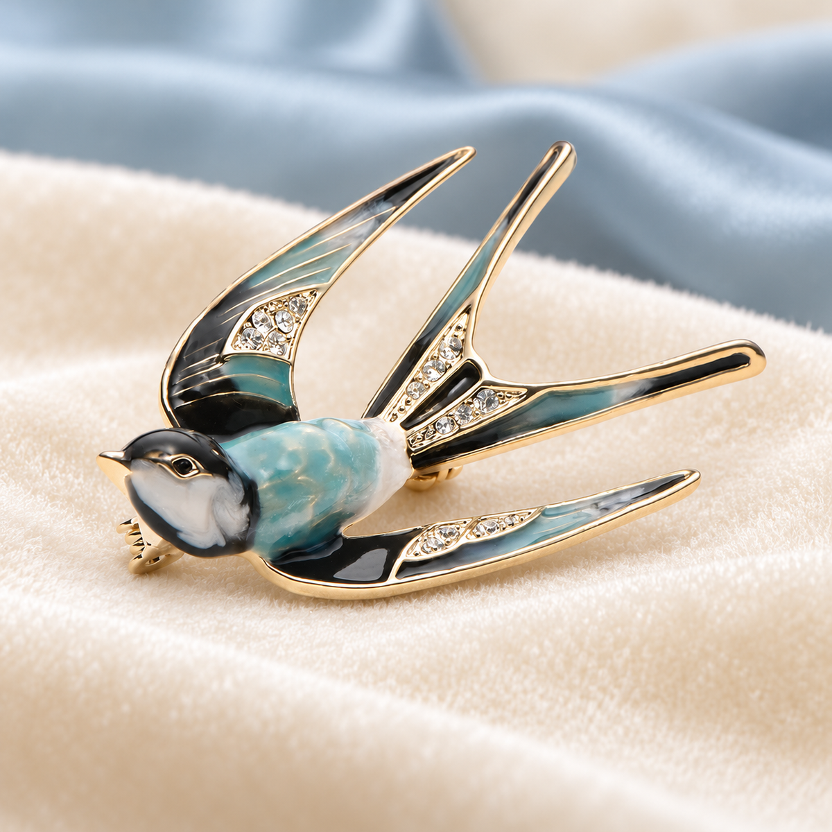 Patterned Enamel Flying Swallow Brooch — styled background