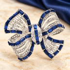 Blue and Clear Rhinestone Ribbon Bow Brooch — styled background