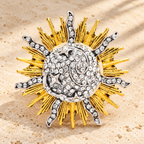 Radiant Sunburst with Rhinestone Center Brooch — styled background