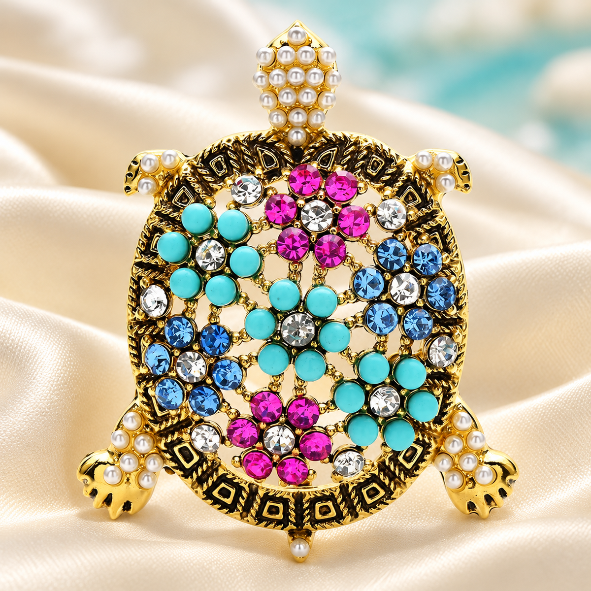 Ornate Multicolor Rhinestone Sea Turtle Brooch — styled background