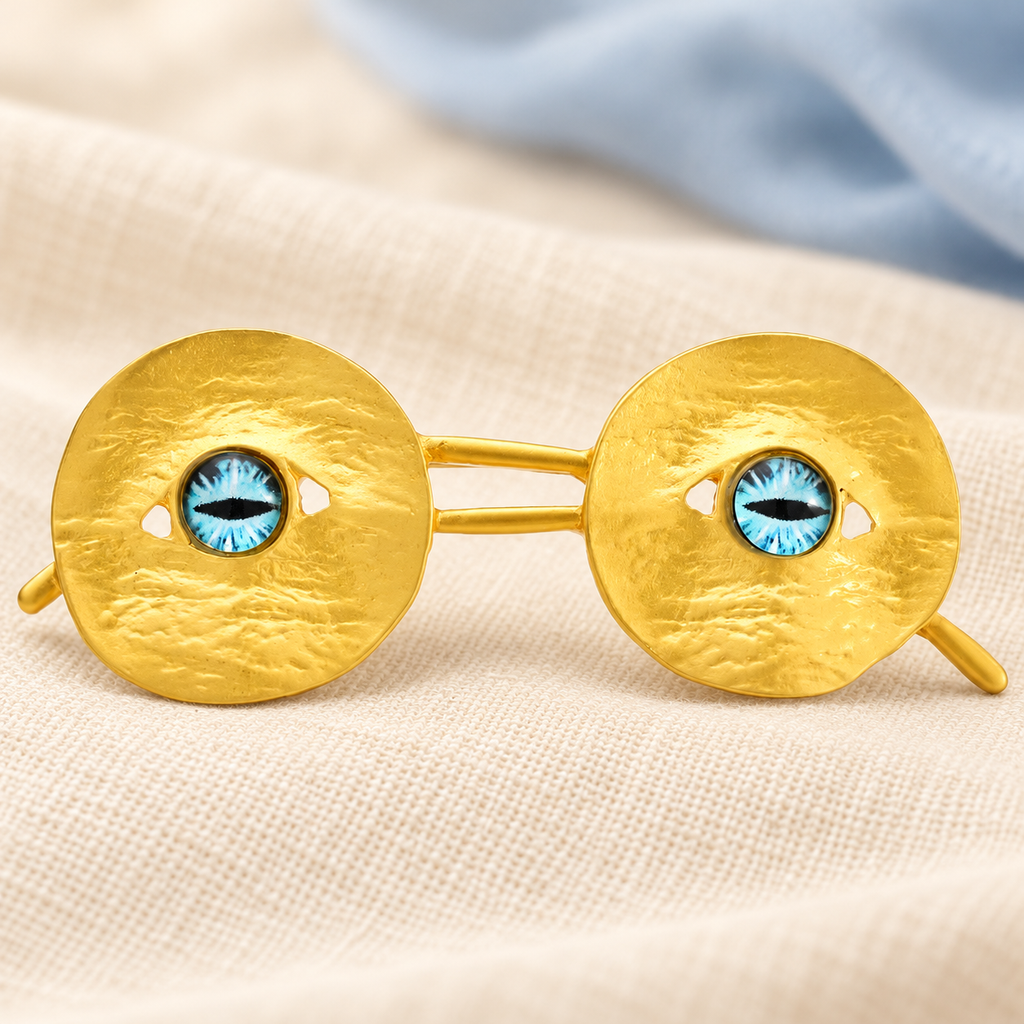 Textured Round Eyeglasses with Blue Lens Accents Brooch — styled background