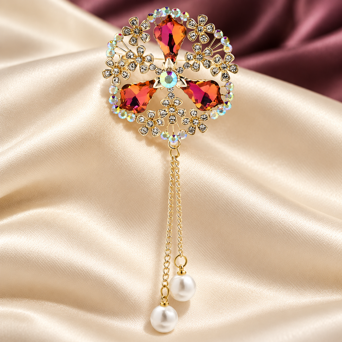 Ornate Faceted Flower with Pearl-Look Tassels Brooch — styled background