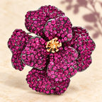 Layered Rhinestone Flower with Golden Center Brooch — styled background