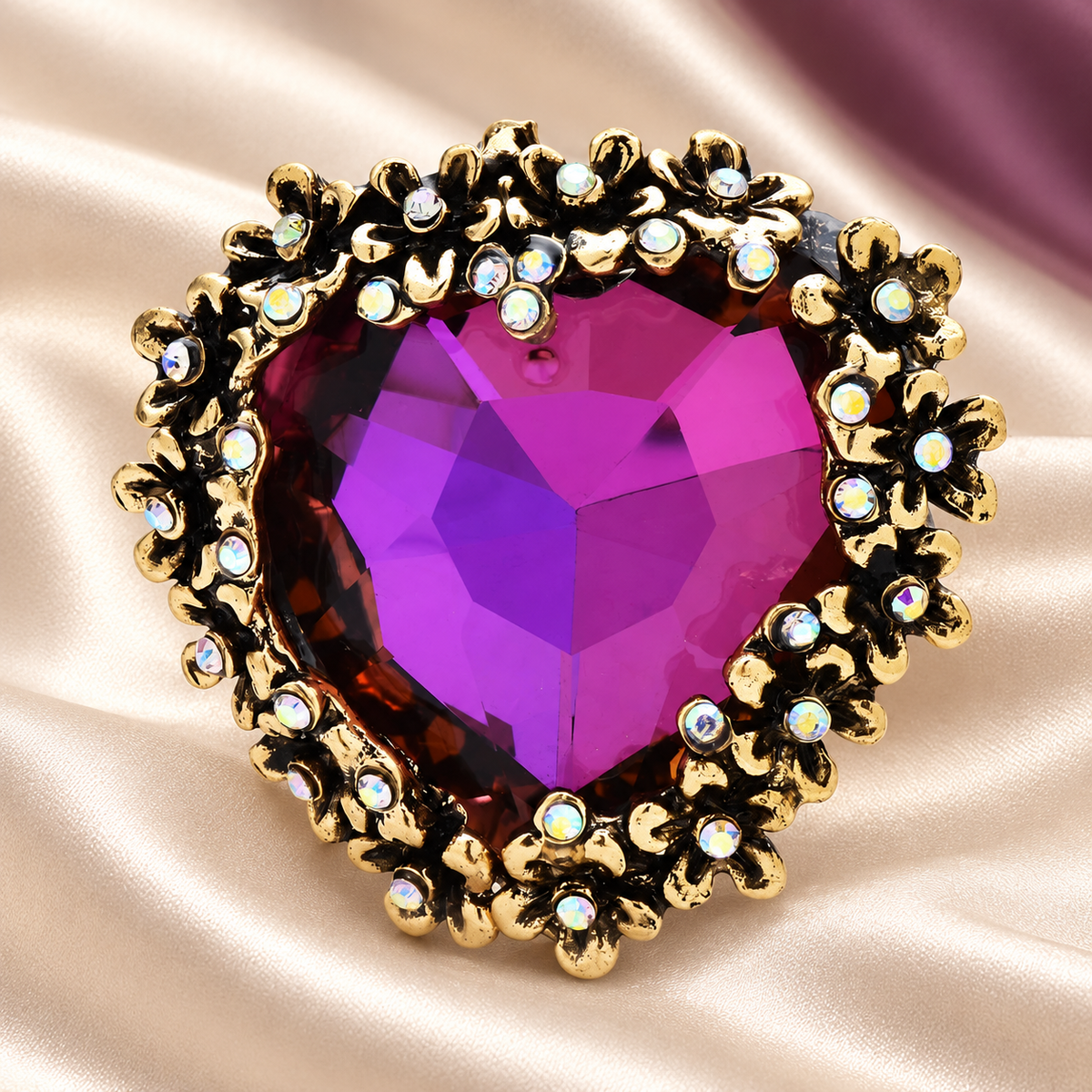 Vintage-Style Faceted Heart with Ornate Floral Border Brooch — styled background