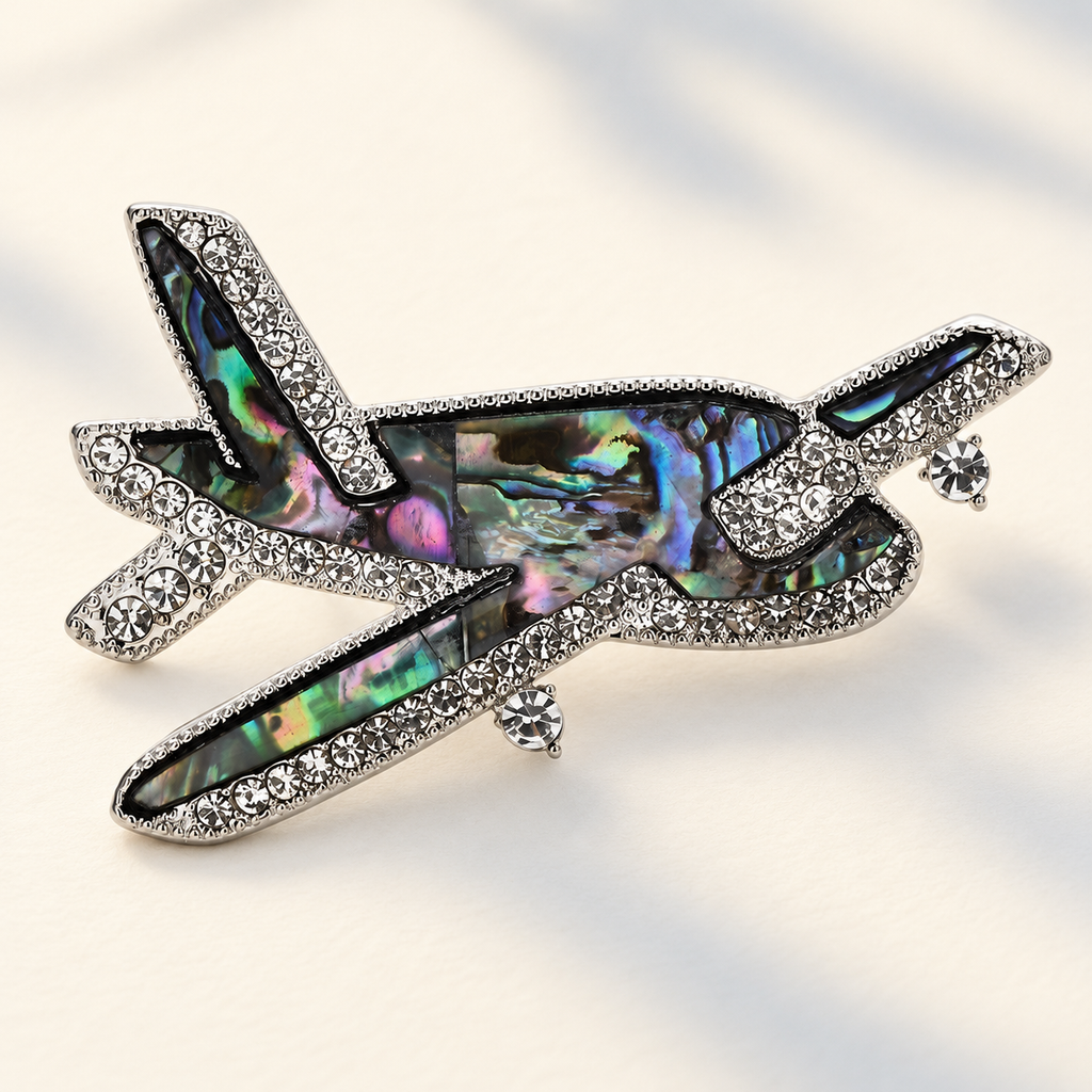 Abalone-Look Airplane with Rhinestone Borders Brooch — styled background