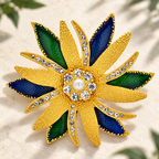 Large Layered Flower with Blue and Green Petals Brooch — styled background