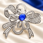 Rhinestone Flower Bow with Blue Center Brooch — styled background