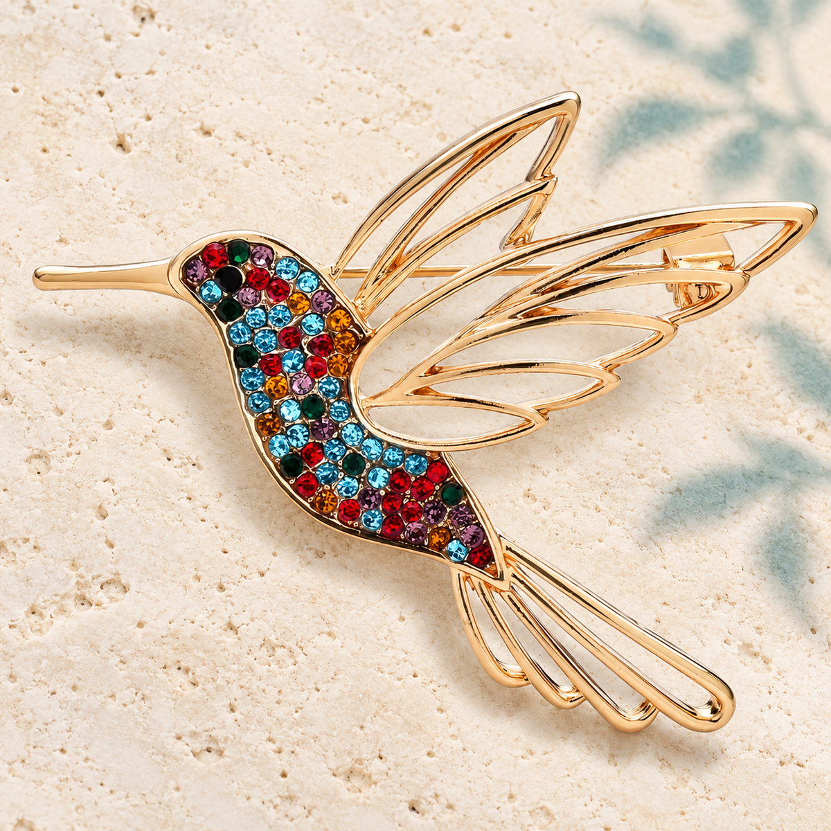 Rhinestone Hummingbird with Openwork Wings Brooch — styled background