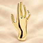 Polished Open Hand Brooch — styled background