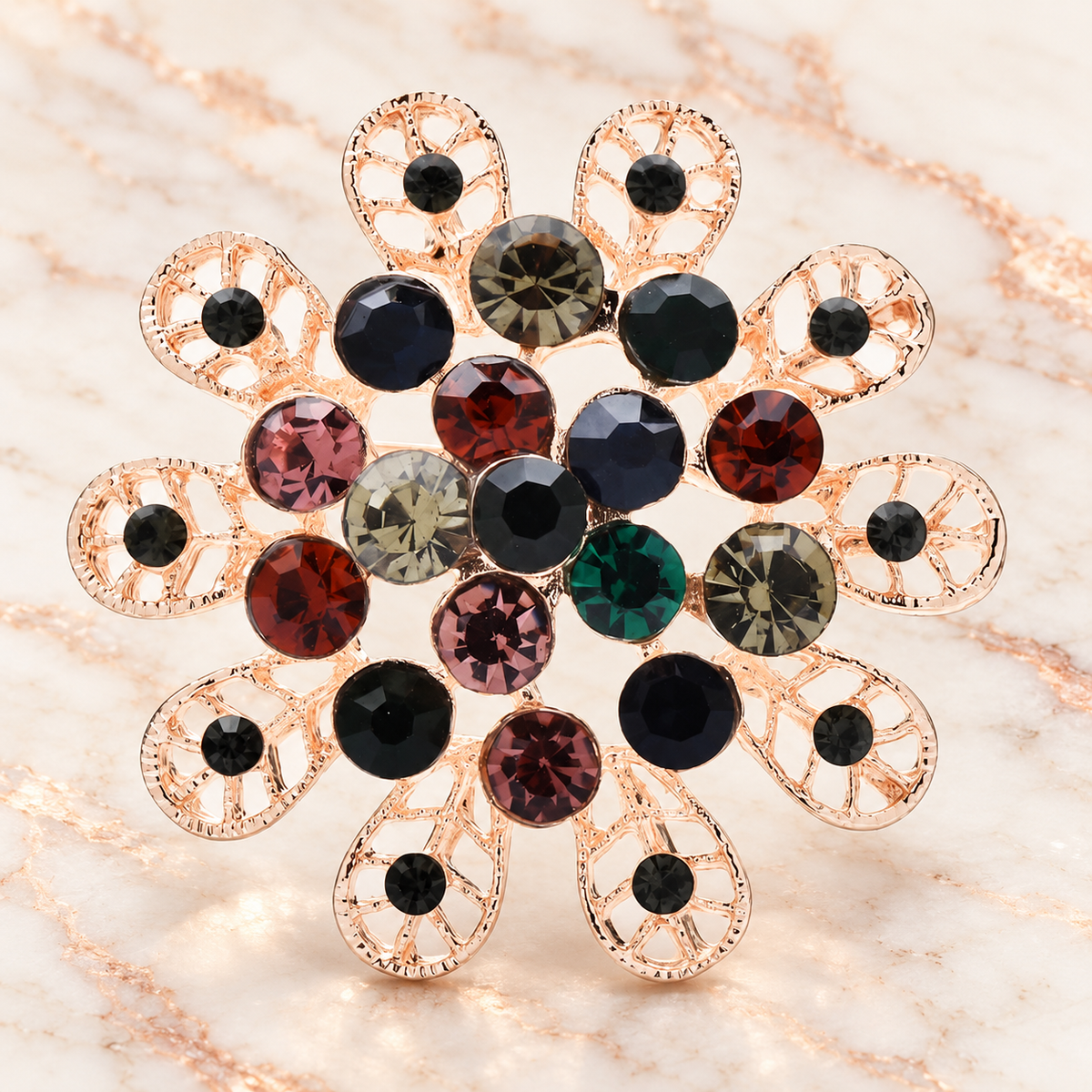 Round Rhinestone Flower with Looped Petals Brooch — styled background
