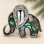 Rhinestone Elephant with Pearl-Look or Abalone-Look Inset Brooch — styled background