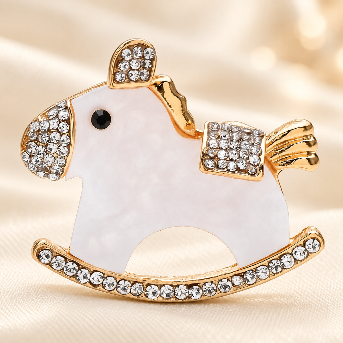 Acrylic Rocking Horse with Rhinestone Trim Brooch — styled background