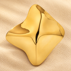 Wavy Diamond-Shaped Metal Brooch — styled background