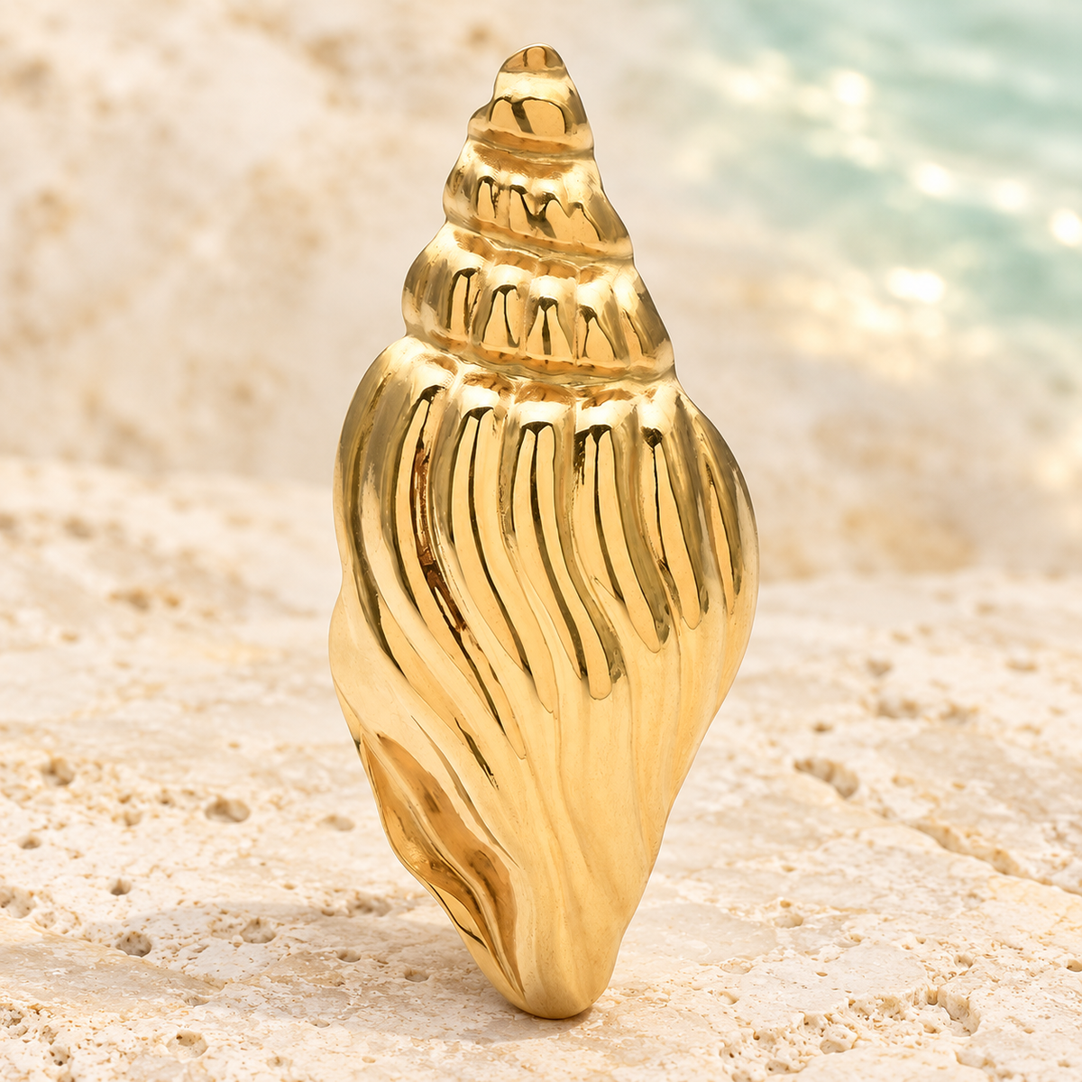 Ridged Spiral Conch Shell Brooch — styled background
