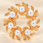 Leaf Wreath with Pearl-Look Accents Brooch — styled background