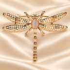 Minimal Openwork Dragonfly Brooch — styled background