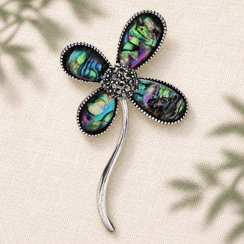 Abalone-Look Four-Petal Flower Brooch — styled background