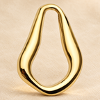Sculptural Teardrop Stainless Steel Brooch — styled background