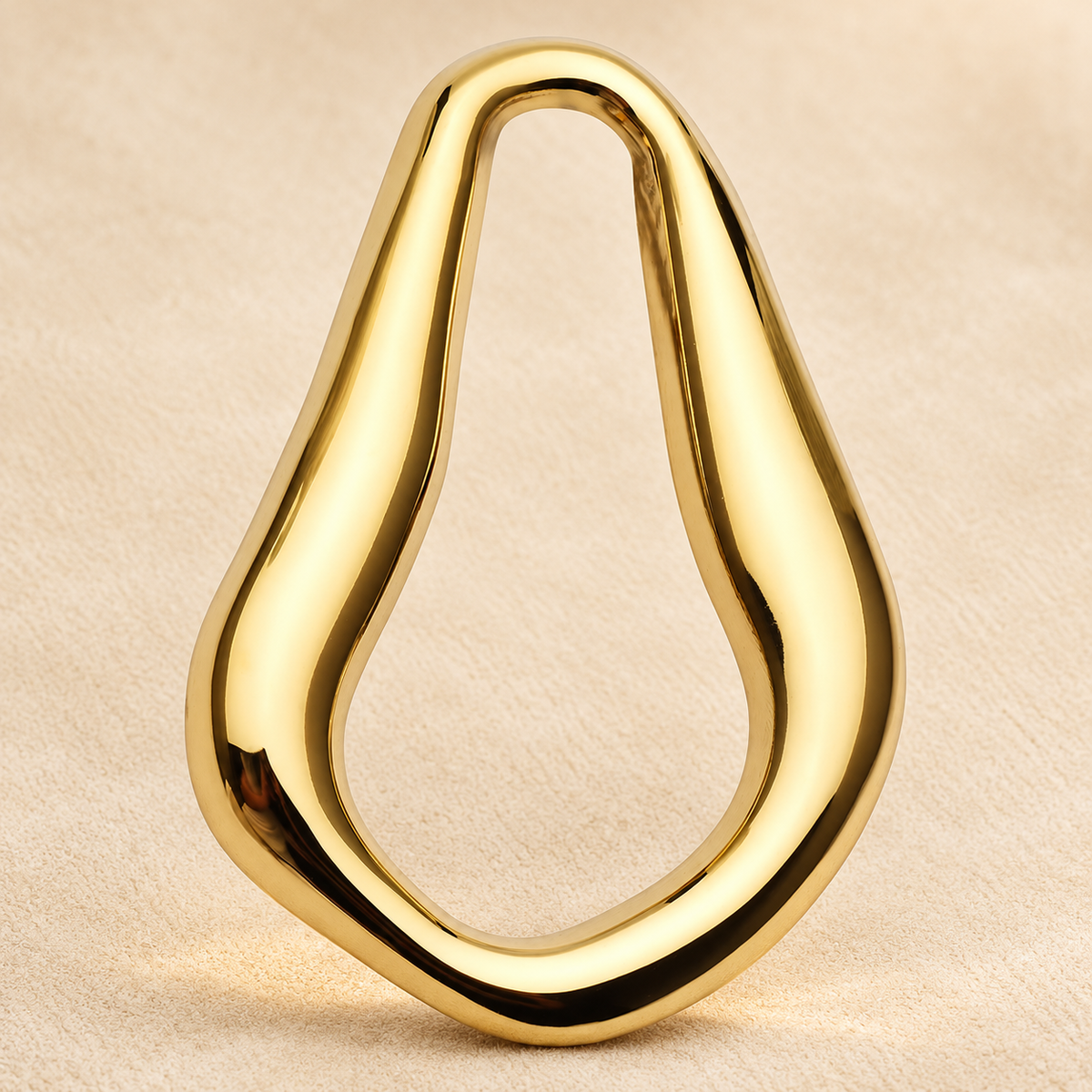 Sculptural Teardrop Stainless Steel Brooch — styled background