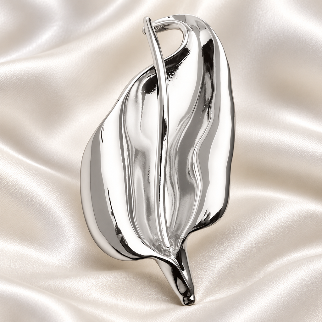 Sculptural Lily Stainless Steel Brooch — styled background