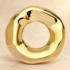 Sculptural Open Disc Stainless Steel Brooch — styled background
