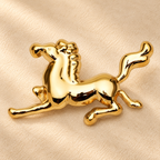 Polished Galloping Horse Stainless Steel Brooch — styled background