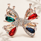 Jeweled Openwork Butterfly Brooch — styled background