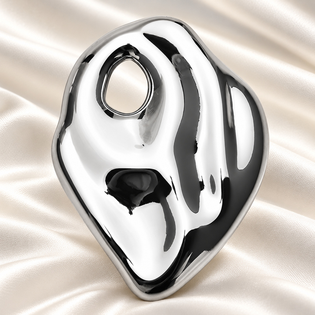 Polished Organic Oval Stainless Steel Brooch — styled background