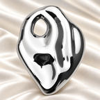 Polished Organic Oval Stainless Steel Brooch — styled background