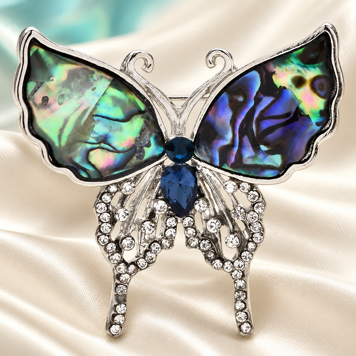 Abalone-Look Butterfly with Rhinestone Drops Brooch — styled background