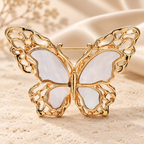 White Openwork Butterfly Brooch — styled background