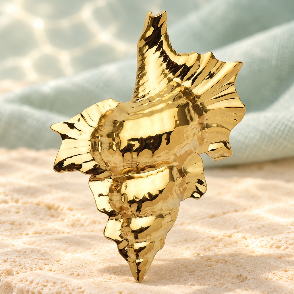 Sculptural Conch Shell Brooch — styled background