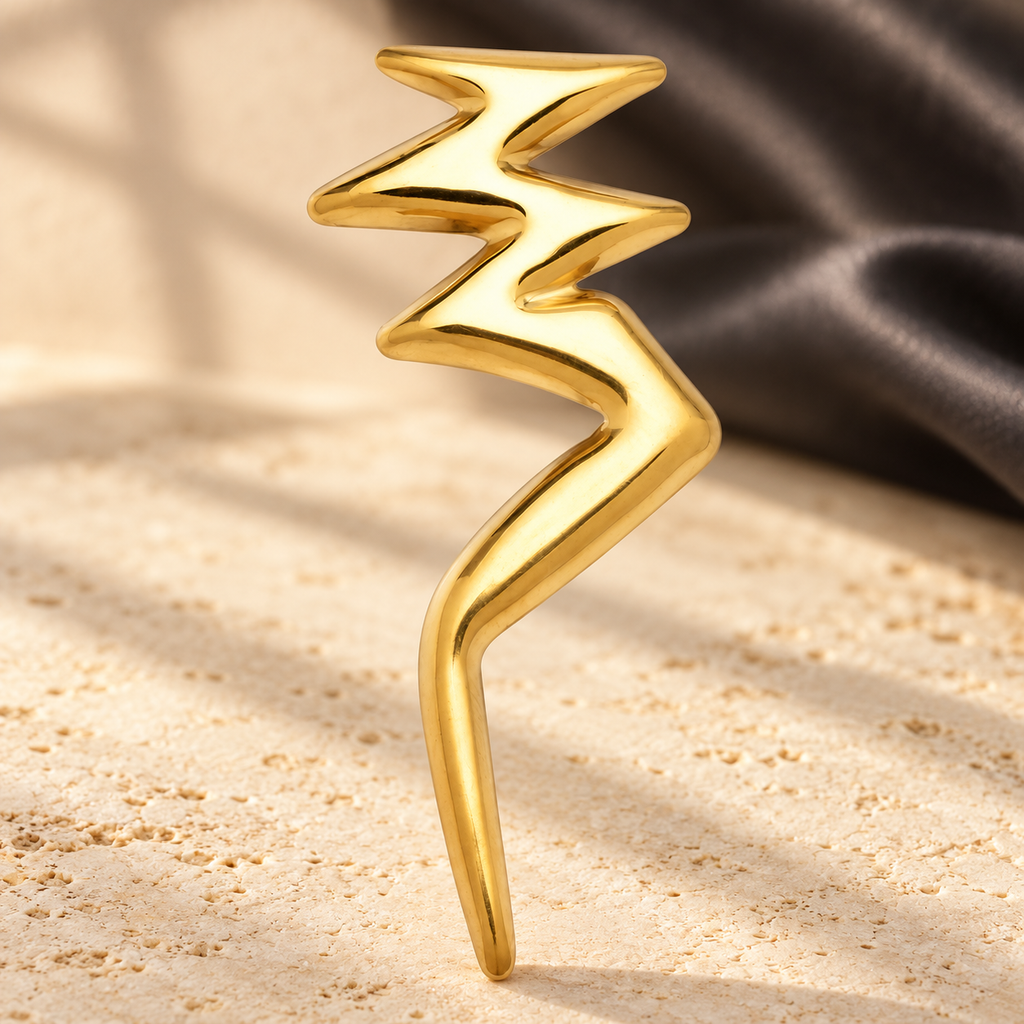 Polished Lightning Bolt Stainless Steel Brooch — styled background