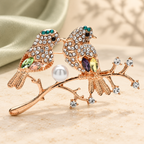Jeweled Bullfinch Pair on Branch Brooch — styled background