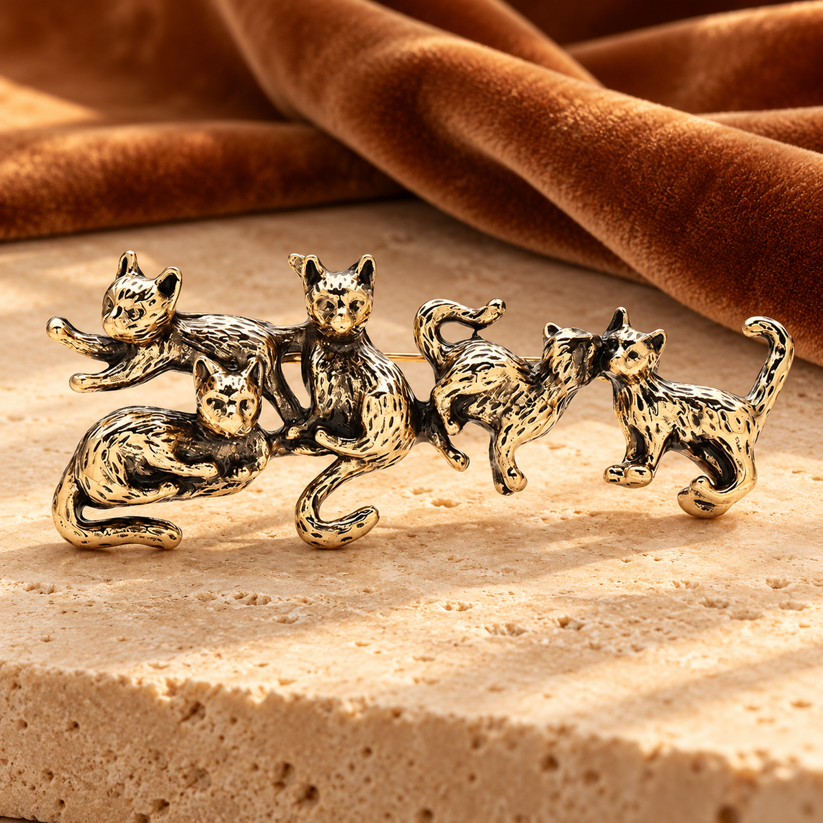 Five Playful Cats with Textured Fur Brooch — styled background