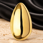 Polished Sculptural Egg Brooch — styled background