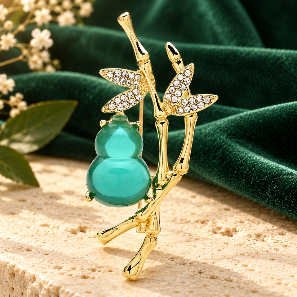 Green Gourd and Bamboo Brooch — styled background