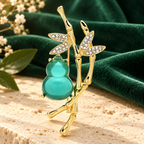 Green Gourd and Bamboo Brooch — styled background