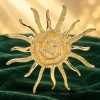 Spiral Sunburst with Rhinestone Accents Brooch — styled background