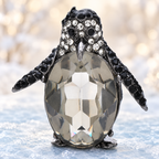 Grey Faceted Penguin with Black Rhinestones Brooch — styled background