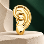Sculptural Ear Brooch — styled background